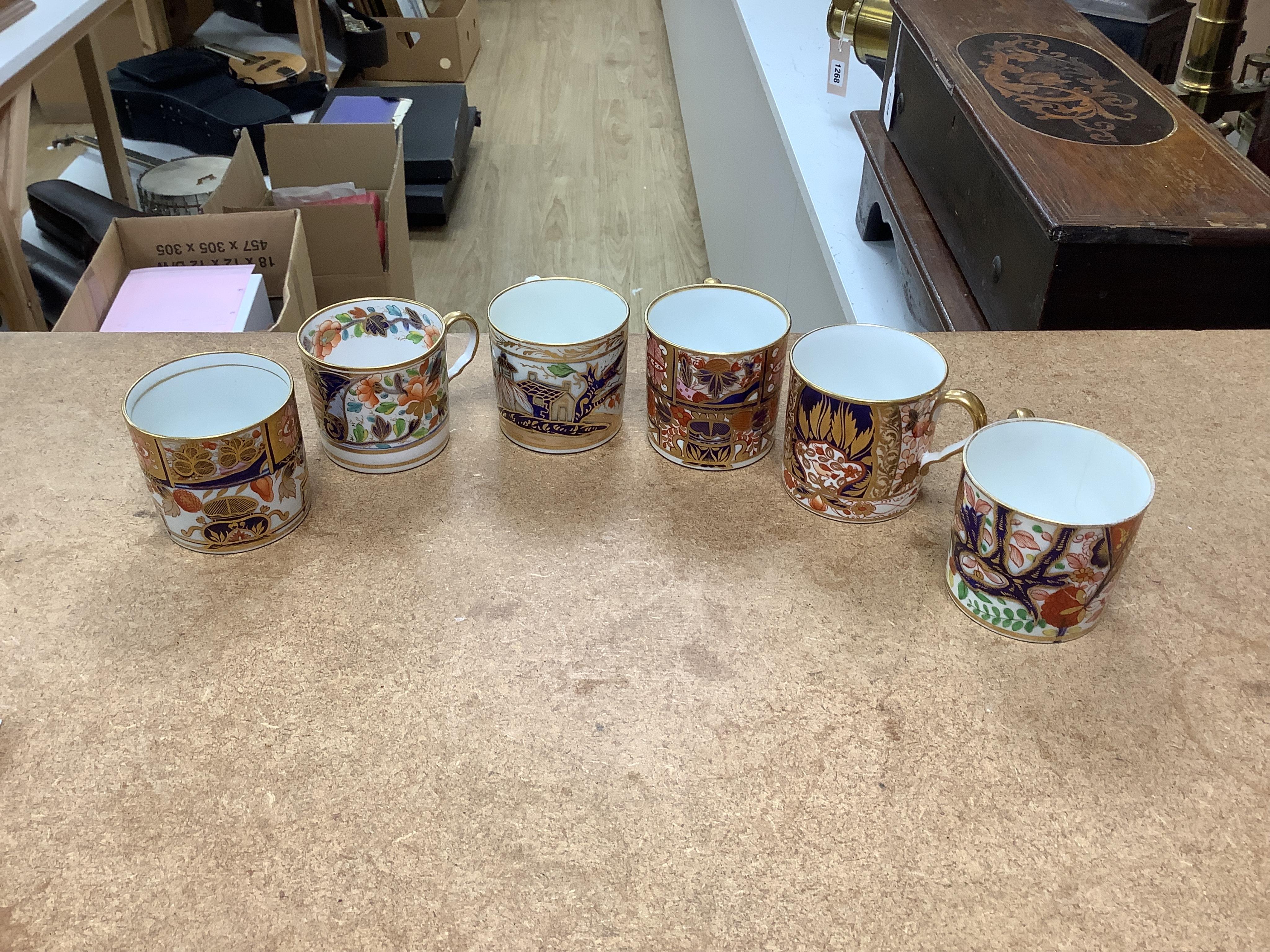 Twelve 1800-1820 English Imari style patterned coffee cans